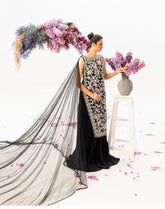 Black Velvet Masterpiece with Floral Embellishments & Dramatic Cape